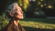 © WS Studio 1985 - Serene Senior Woman Breathing Deeply in a Lush Green Park
