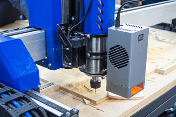 Poster - Milling machine. Equipment for drilling plywood. Process of milling boards. Milling machine during operation. Carpentry tech. Drilling holes with industrial equipment. Machine in carpentry shop.