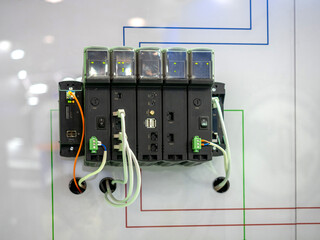 Poster - Programmable logic controller. Electronic equipment. Industrial electronic device. Controller for automatic control of production processes. Programmable logic controller on white surface