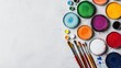 © OngCaLucK - Colorful art supplies arranged in an artistic flatlay vibrant textures creative energy soft natural lighting top-down view