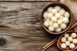 © AHNH3 - Delicate Round Dumplings in Bowl on Rustic Wooden Table
