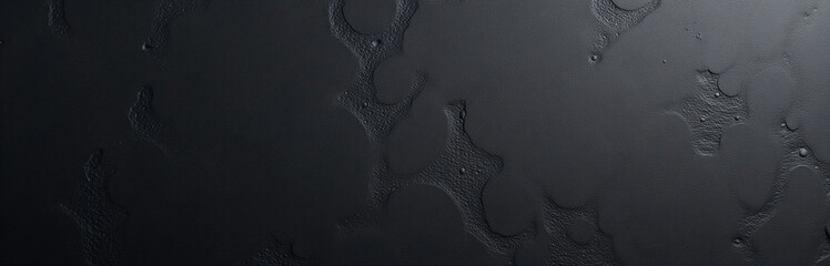 Aufkleber - A Dark Rough Textured Concrete Wall Features Decorative Plaster With A Black Stone Background For Aesthetic Appeal.