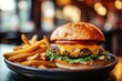 © azwan - Double cheeseburger with lettuce tomato and onion served with golden fries with fine restaurant background