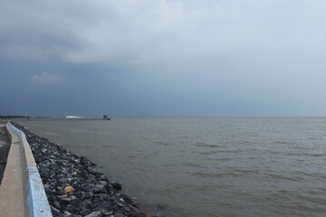 Wall Mural - landscape of sea on sunset with rain cloud coming
