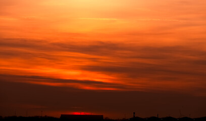 Wall Mural - sunset red sky,cloud background,summer sunrise with orange, yellow sky in countryside,autumn nature 