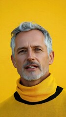 Poster - A man wearing a yellow sweater and a beard, a simple and classic image.