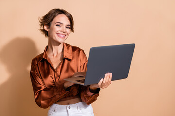 Poster - Photo of adorable pretty girl wear brown blouse chatting instagram twitter telegram facebook empty space isolated beige color background