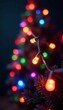 © OneWayPhoto - Twinkling string of colorful Christmas lights in festive holiday background , yellow, red
