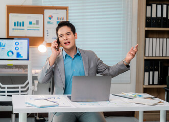 Poster - Businessman Engaging in Intense Phone Discussion at Desk