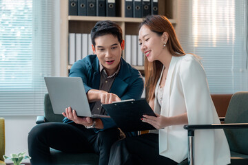 Poster - Asian businesspeople discussing working using laptop and clipboard in office