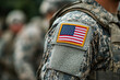 © Natalia - Soldier in uniform saluting with American flag on chest.