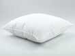 © bitano - White cotton pillow isolated on a clean white background for bedding and home comfort