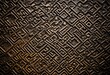 © Daniel - A close up of a metal surface with a pattern on it.