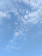 Wall Mural - azure sky with fleeting clouds. a clear blue sky with a few wispy clouds, soft lighting, high - reso