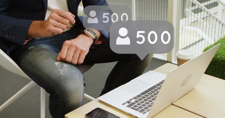 Poster - Image of emoji icons and numbers over man using smartwatch and laptop