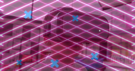 Poster - Abstract shapes and network of digital icons against boy wearing vr headset at school