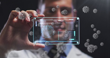 Poster - Image of covid cells over male doctor holding screen with medical data processing