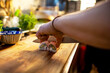 © Marko Geber - Chef slicing sushi rolls on wooden board in restaurant kitchen