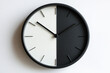 © Birzhan - -toned clock with contrasting colors: black hour display on white background and white hour display on black background.