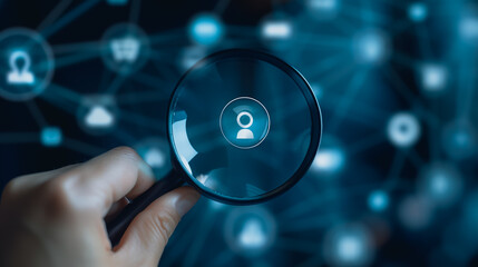 Poster - Examining Digital Connections: An up-close image depicts a hand holding a magnifying glass focused on a network of interconnected icons, symbolizing online search, the investigation of data.