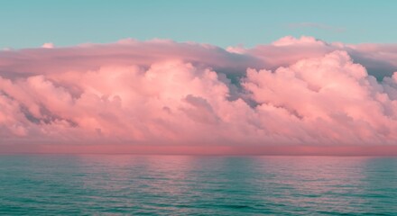 Wall Mural - pink clouds over calm ocean - serene landscape of a vast pink cloud formation above a tranquil ocean
