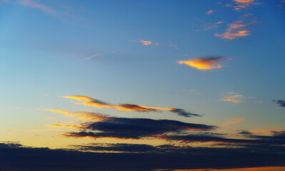 Wall Mural - beautiful and dramatic sunset sky with clouds as abstract background