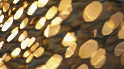 Poster - Golden bokeh light patterns creating dynamic abstract background