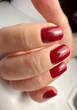 © Ольга Клецкова - Female hand with red manicure, nail design, christmas manicure