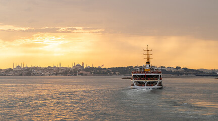 Aufkleber - Bosphorus sunset with a ferry cruising towards Istanbuls skyline