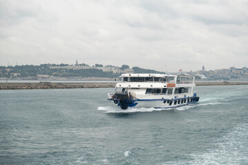 Aufkleber - Nautical journey across the Bosphorus with a ferry navigating the waters under overcast skies