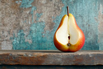 Poster - A sliced pear showing its delicate seed core, set against a dark rustic background