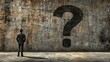 © afif - Businessman facing large question mark on grunge wall, uncertainty concept, website banner