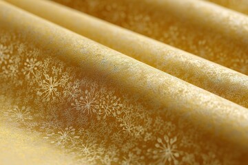 Poster - Elegant golden fabric with intricate snowflake patterns draping beautifully across a surface