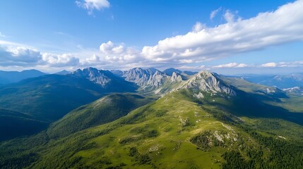 Poster - Aerial View of Majestic Mountains with Lush Greenery Under a Bright Blue Sky with Fluffy Clouds : Generative AI
