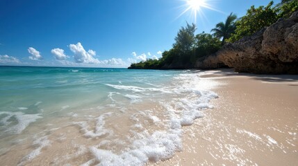 Poster - Idyllic sunny day at tropical beach with foamy wave gently washing the light sand shore, turquoise sea, and green foliage against a clear blue sky with scattered clouds, evoking a sense of