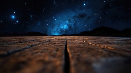 Wall Mural - A captivating night scene featuring a weathered wooden surface with prominent cracks, set against a backdrop of silhouetted mountains and a vibrant, star-filled sky, creating a serene and