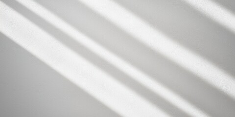 Poster - A serene abstract image featuring soft light and shadows on a textured gray surface, creating a calming visual effect.