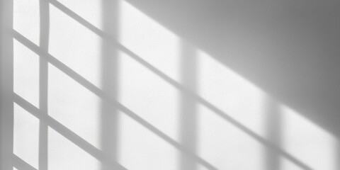 Poster - A serene play of light and shadow creates a geometric pattern on a white wall.
