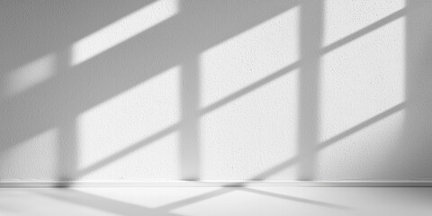 Poster - A minimalist interior scene featuring soft shadows cast by window panes onto a textured white wall.