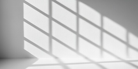 Poster - A minimalist interior with soft shadows cast by a grid-like window pattern on a light wall.