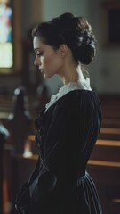 Poster - A woman stands in a church, wearing a long black dress.