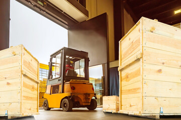 Poster - Warehouse center. Pallets with boxes in building. Forklift inside storage hangar. Cardboard parcels on boxes. Warehouse area. Forklift is loading. Delivery service warehouse. Logistics processes