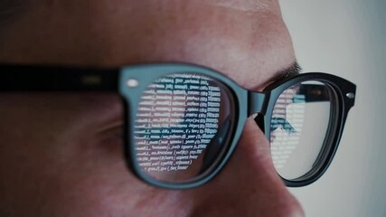 Aufkleber - Computer programmer wearing glasses, reflecting lines of code while intensely analyzing software development project on digital screen in modern office environment