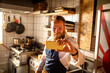 © Marko Geber - Smiling male sushi chef taking selfie in Japanese restaurant kitchen