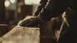 © Jorda - Construction worker inspecting a wooden beam for quality. Featuring attention to detail and expertise
