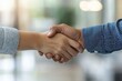 © Ifti Digital - Business colleagues engage in a handshake in a modern office lobby during a professional meeting, business colleagues shaking hands in the office lobby