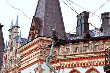 Poster - A tall structure with a clock face on the top, often found in city centers.