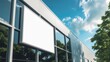 © Cyber Shutter - Unoccupied company nameboard on an industrial building. Template for branding on a facade. Exterior of a production hall with a blank spot for a promotional banner.