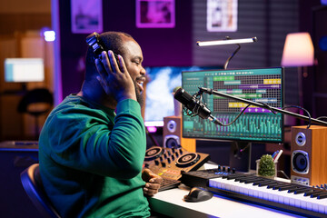 Poster - Young artist performer recording his voice and lyrics in home studio, working on launching new music with microphone and professional stereo gear. Singer performing a track, edit with mixing console.