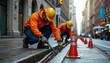 © sofyanam - Street workers fixing roadside infrastructure